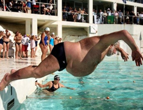 fat man jumps in a swimming pool