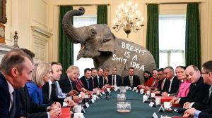 Brexit meme elephant in the room with a sign that brexit is a shit idea in front of politicians