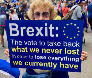 Brexit joke protest A woman holding a sign saying the vote to take back what we never lost